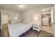 A charming bedroom with hardwood floors, shuttered windows and bright walls at 5918 Barrowlands Ct, Charlotte, NC 28210