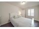 A bright bedroom features a comfortable bed, shuttered windows and neutral walls at 5918 Barrowlands Ct, Charlotte, NC 28210