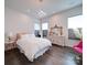 Bright bedroom features wood floors, white walls, and an eclectic decor at 5918 Barrowlands Ct, Charlotte, NC 28210
