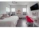 Bright bedroom featuring stylish furnishings, wood floors, and large windows for natural light at 5918 Barrowlands Ct, Charlotte, NC 28210