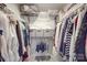 This well-organized walk-in closet maximizes storage with shelves, drawers, and hanging rods for clothes at 5918 Barrowlands Ct, Charlotte, NC 28210