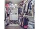 A well-organized walk-in closet boasts ample storage with shelves, drawers, and hanging rods for clothes and accessories at 5918 Barrowlands Ct, Charlotte, NC 28210