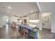 Open dining area showcasing a unique blue table and modern decor at 5918 Barrowlands Ct, Charlotte, NC 28210