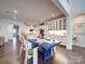 This dining room features a blue table, hardwood floors, and plenty of natural light at 5918 Barrowlands Ct, Charlotte, NC 28210