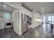 Bright kitchen featuring stainless appliances, white cabinets, and an adjacent laundry room at 5918 Barrowlands Ct, Charlotte, NC 28210