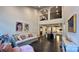 Bright, open-concept living space with high ceilings and hardwood floors flowing into the dining and kitchen areas at 5918 Barrowlands Ct, Charlotte, NC 28210
