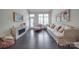 Bright living room featuring large windows and white walls at 5918 Barrowlands Ct, Charlotte, NC 28210