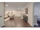 Spacious living room with hardwood floors, neutral walls, and access to a bedroom at 5918 Barrowlands Ct, Charlotte, NC 28210