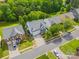 Aerial view of a home with lush greenery and mature trees in a well-maintained neighborhood at 6424 Chadwell Ct, Fort Mill, SC 29707