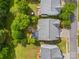 Property aerial view highlighting a backyard with a fire pit and upper-level deck surrounded by lush greenery at 6424 Chadwell Ct, Fort Mill, SC 29707