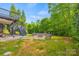 A charming backyard with a stone fire pit and a two-level deck, perfect for gatherings and enjoying outdoor space at 6424 Chadwell Ct, Fort Mill, SC 29707