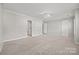 Spacious bedroom featuring neutral paint, ceiling fan, and ensuite bathroom access at 6424 Chadwell Ct, Fort Mill, SC 29707