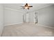 Bedroom featuring neutral paint, ceiling fan, and ensuite bathroom access at 6424 Chadwell Ct, Fort Mill, SC 29707