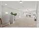 Spacious bonus room with carpet flooring, ceiling fan and natural light at 6424 Chadwell Ct, Fort Mill, SC 29707