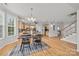 Spacious dining area that flows into an open-concept kitchen and the staircase to the second floor at 6424 Chadwell Ct, Fort Mill, SC 29707
