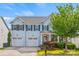 Charming two-story home with a well-manicured lawn, two-car garage, and inviting curb appeal at 6424 Chadwell Ct, Fort Mill, SC 29707
