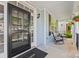Inviting front porch with rocking chairs and hanging flower baskets, offering a relaxing outdoor space at 6424 Chadwell Ct, Fort Mill, SC 29707