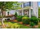 Lush landscaping, including shrubbery and flowering plants, enhances the curb appeal of this home at 6424 Chadwell Ct, Fort Mill, SC 29707