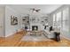 Cozy living room with a fireplace, built-in bookshelves and plush furnishings at 6424 Chadwell Ct, Fort Mill, SC 29707