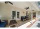 Cozy covered patio with comfortable seating and access to the serene backyard at 6990 Ridgeway Rd, Stanley, NC 28164