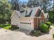 Spacious two-car garage with brick and siding exterior and basketball hoop at 6990 Ridgeway Rd, Stanley, NC 28164