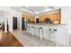 Eat-in kitchen featuring an island with bar seating, stainless steel appliances, and tile floors at 6990 Ridgeway Rd, Stanley, NC 28164