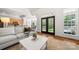 Comfortable living room with stylish furniture, neutral decor, and lots of natural light at 6990 Ridgeway Rd, Stanley, NC 28164