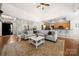 Spacious living room with an open floor plan with views of the kitchen and dining area at 6990 Ridgeway Rd, Stanley, NC 28164