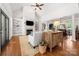 Bright living room featuring a fireplace, built-in shelving, and hardwood floors at 6990 Ridgeway Rd, Stanley, NC 28164