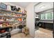 Pantry boasts with shelving, providing generous storage solutions and the door leading to the laundry area at 6990 Ridgeway Rd, Stanley, NC 28164