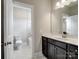 View of bathroom with vanity, toilet, and shower/tub combination with neutral colors at 709 Cavesson Way, Monroe, NC 28110