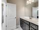 Bathroom vanity with a sink and a door leading to another room at 709 Cavesson Way, Monroe, NC 28110