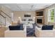 Inviting living room with a coffered ceiling, fireplace, and stylish furniture at 709 Cavesson Way, Monroe, NC 28110