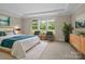 Bright main bedroom with large windows, tray ceilings, and views of the manicured lawn at 709 Cavesson Way, Monroe, NC 28110