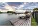 Peaceful lake view with a private dock and sun loungers, perfect for a relaxing lakeside retreat at 7220 Swansea Ln, Cornelius, NC 28031