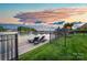 Scenic lake view with a private dock featuring sun loungers, perfect for relaxing by the water at 7220 Swansea Ln, Cornelius, NC 28031