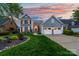 Charming two-story home with a manicured lawn, well-maintained landscaping, and a two-car garage at 7220 Swansea Ln, Cornelius, NC 28031