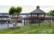 Scenic view of waterfront gazebo and boat docks, creating a tranquil outdoor space at 7220 Swansea Ln, Cornelius, NC 28031