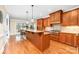 Spacious kitchen with custom wood cabinets, an island, and stainless appliances at 7220 Swansea Ln, Cornelius, NC 28031