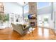 Cozy living room featuring a stone fireplace and stunning water views at 7220 Swansea Ln, Cornelius, NC 28031
