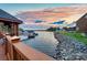 Picturesque waterfront view with a beautiful sunset sky at 7220 Swansea Ln, Cornelius, NC 28031