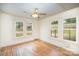 Bedroom with hardwood floors and multiple windows providing natural light and views at 813 S Ridge Ave, Kannapolis, NC 28083