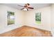 Bedroom with hardwood floors, neutral walls, and natural light from two windows at 813 S Ridge Ave, Kannapolis, NC 28083