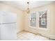 The dining area offers tile floors, natural lighting, and traditional light fixture at 813 S Ridge Ave, Kannapolis, NC 28083