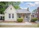 Charming one story home featuring a brick facade, covered porch, and well-maintained landscaping at 813 S Ridge Ave, Kannapolis, NC 28083