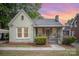 Charming home with a cozy front porch, lush landscaping, and a classic brick exterior at 813 S Ridge Ave, Kannapolis, NC 28083