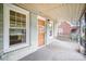 Inviting porch with swing, showcasing the front door and windows of the home at 813 S Ridge Ave, Kannapolis, NC 28083