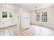 Eat-in kitchen area with a refrigerator, sink, and large windows providing natural light at 813 S Ridge Ave, Kannapolis, NC 28083