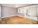 Living room showcasing the open flow to kitchen, hardwood floors, and ample natural light at 813 S Ridge Ave, Kannapolis, NC 28083