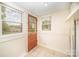 Mud room with tile flooring, windows and door to backyard at 813 S Ridge Ave, Kannapolis, NC 28083